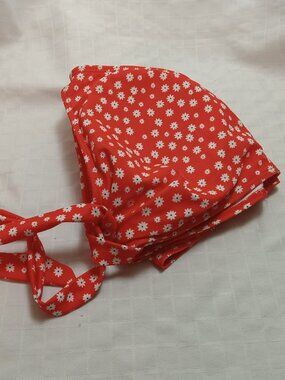 Red, white, and black floral swimsuit top with a bow at the front; never worn